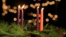 An Advent wreath with four lit candles represents the fourth week of Advent.  Photo by Kathleen Barry, United Methodist Communications.