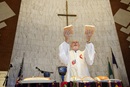  Bishop Joel Martínez blesses the elements of Holy Communion during opening worship at the 2011 MARCHA meeting at the Lydia Patterson Institute in El Paso, Texas. Photo by Mike DuBose, UM News.