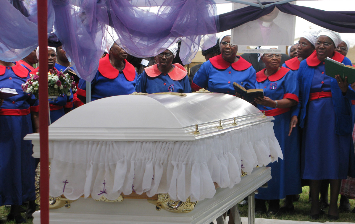 Women gather near the casket of United Methodist Bishop Abel T. Muzorewa in Mutare, Zimbabwe, in May of 2010. Some 5,000 people attended Bishop Muzorewa's funeral. Photo by Tafadzwa Mudambanuki, UM News.