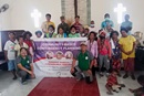 Members of the Aetas community pose for a photo with a team from The United Methodist Church in the Philippines, including Phine M. Cedillo (left of the sign in green shirt), Rommuel S. Flores (to the right of the sign) and the Rev. Willie Tolentino (in yellow shirt in back). The group participated in Community-based Contingency Planning at Mawacat United Methodist Church in Florida Blanca, Pampanga. Photo courtesy of the Rev. Willie Tolentino.