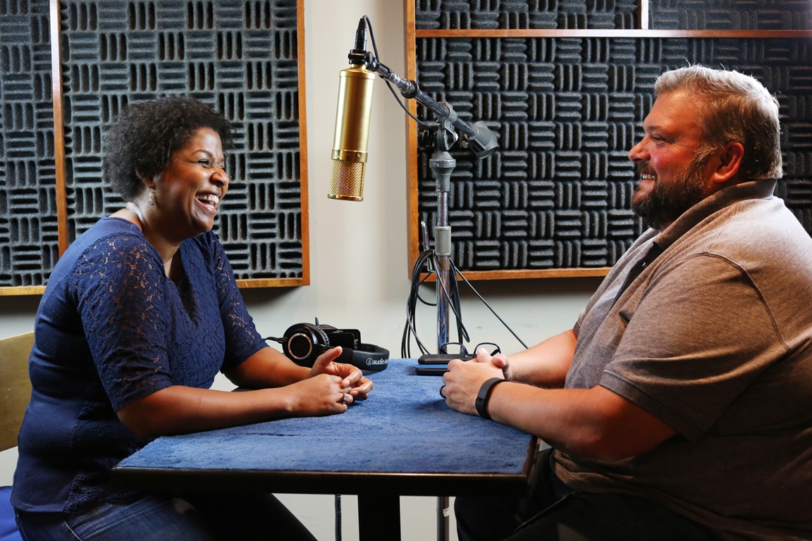 Podcast host Joe Iovino talks with the Rev. Sheila Bates, who shares ideas to help students find places to grow in their faith while they are away at college. Photo by Kathleen Barry, UNM News.