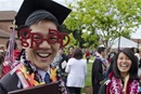 Student celebrates after graduation at the University of Puget Sound in Tacoma, WA. Photo courtesy of Ross Mulhausen, University of Puget Sound.