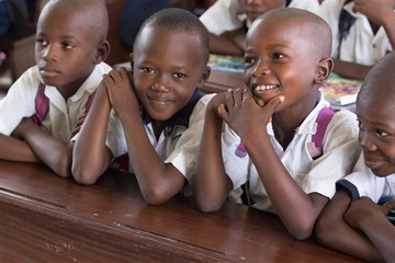 Students laugh in a classroom in East Congo. Photo by Mike DuBose, United Methodist News Service. 
