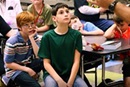 Students listen during a VBS session led by members of St. Paul UMC in Abilene, Texas. Video image by United Methodist Communications. 