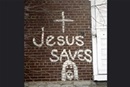 Graffiti on wall reads, "Jesus Saves." Public domain photo by Daniel Lobo.
