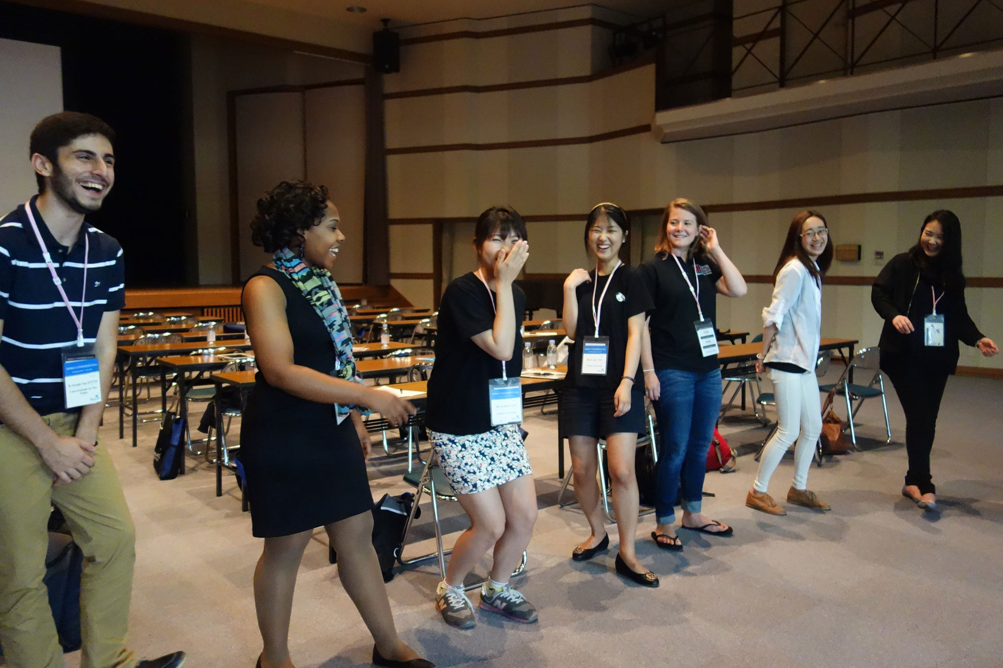 Students attending the triennual IAMSCU Conference pass an imaginary "energy ball" during a workshop at Hiroshima Jagakuin University on May 27, 2014. File photo by Diane Degnan, United Methodist Communications.