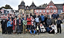 The Standing Committee on Central Conference Matters, an international United Methodist leadership body, gathers in front of the entrance to a medieval castle in Braunfels, Germany. During a meeting in Braunfels, the group discussed the challenges facing its proposed Africa Comprehensive Plan, which would add five more bishops to the continent. Photo by Klaus Ulrich Ruof, Germany Central Conference.